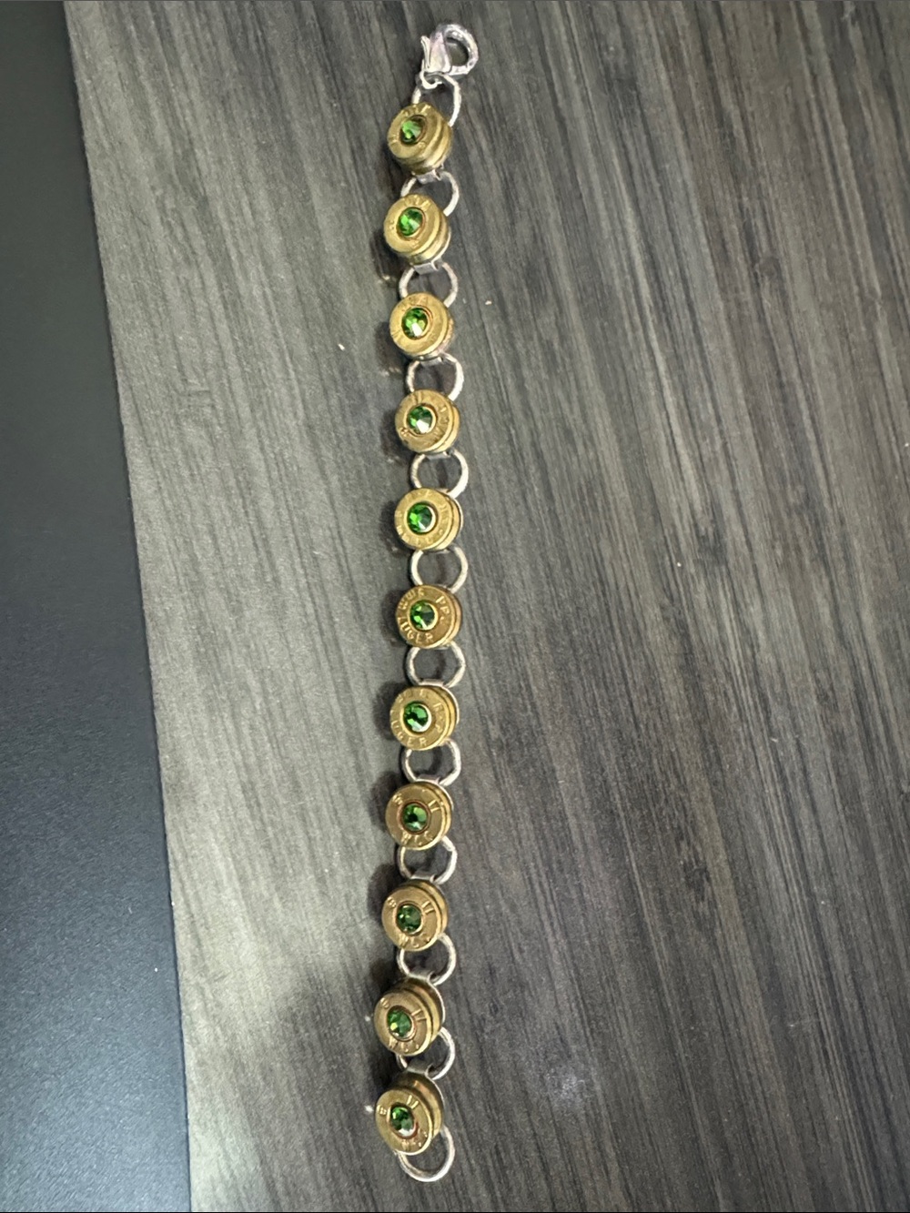 Green stone in bullet bracelet